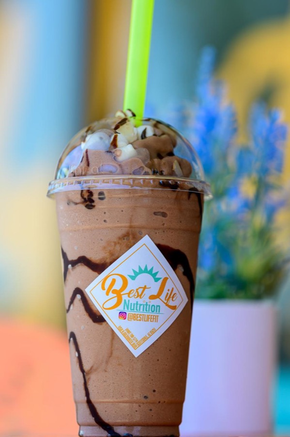 A chocolate protein smoothie in a Best Life Nutrition cup